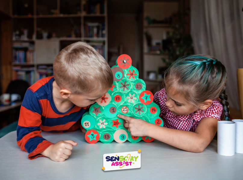 Seasonal activity for kids making handmade advent calendar with toilet paper rolls at home.