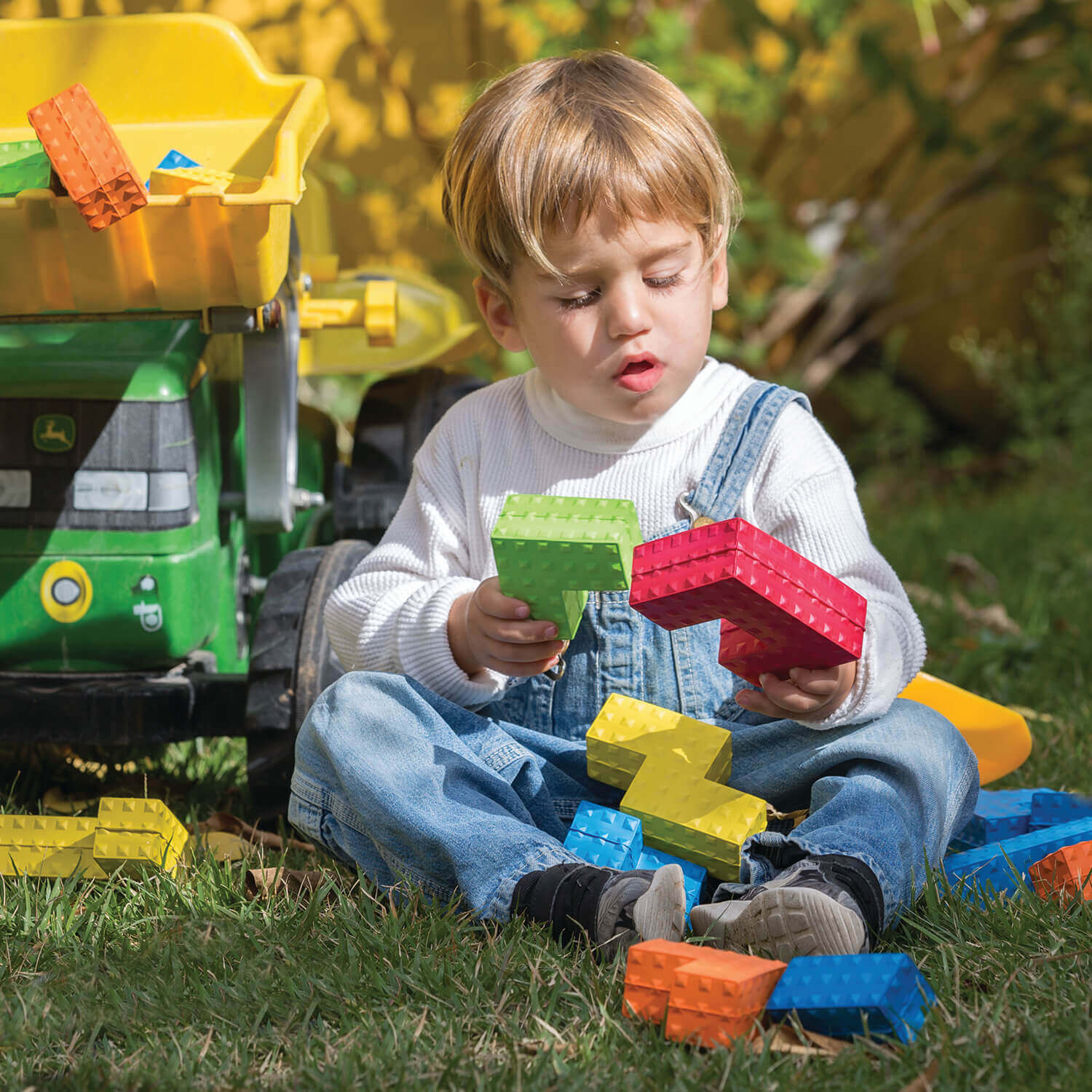 Child playing with tactile development toys