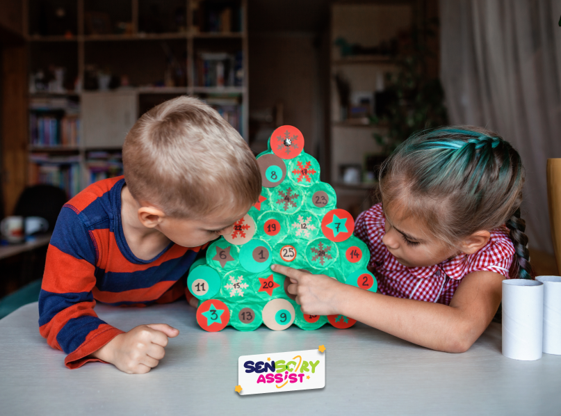 Seasonal activity for kids making handmade advent calendar with toilet paper rolls at home. 