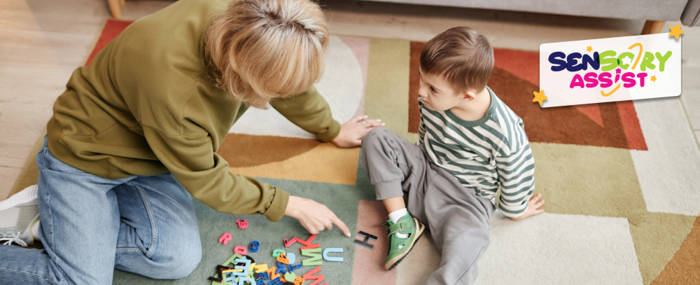 Top view of happy little boy with down syndrome playing with mother