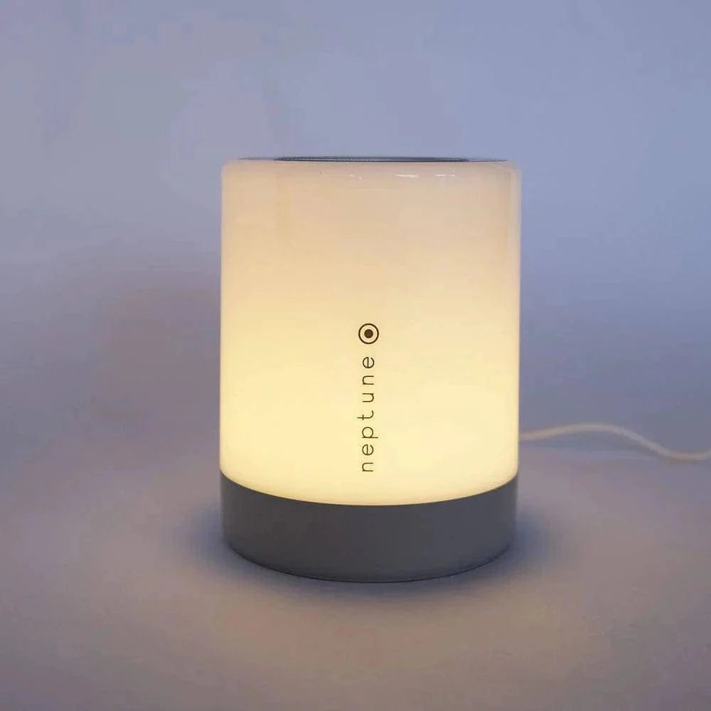 Neptune Sleep Lamp III on bedside table — colour-changing wind-down lamp
