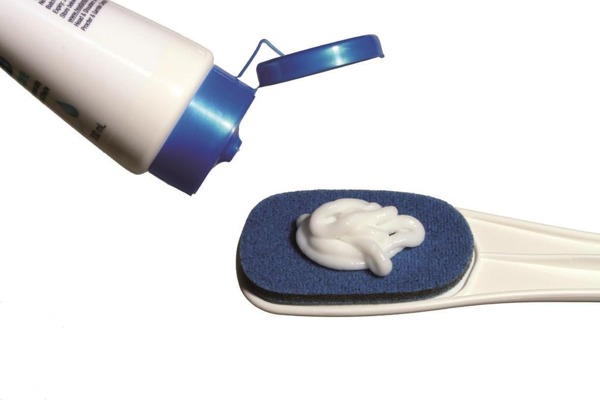 Lotion being applied to the Easy-Reach applicator pad