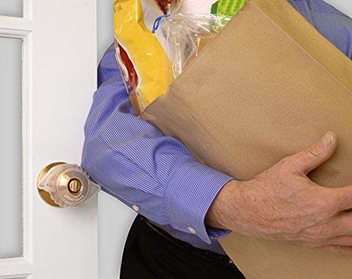 Man carrying groceries opening a door with Great Grips fitted
