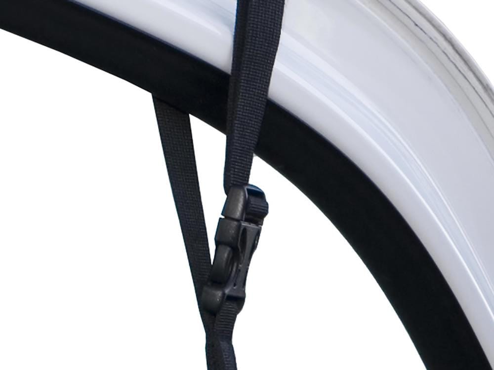 Stander Car Caddie strap hanging from the car window frame
