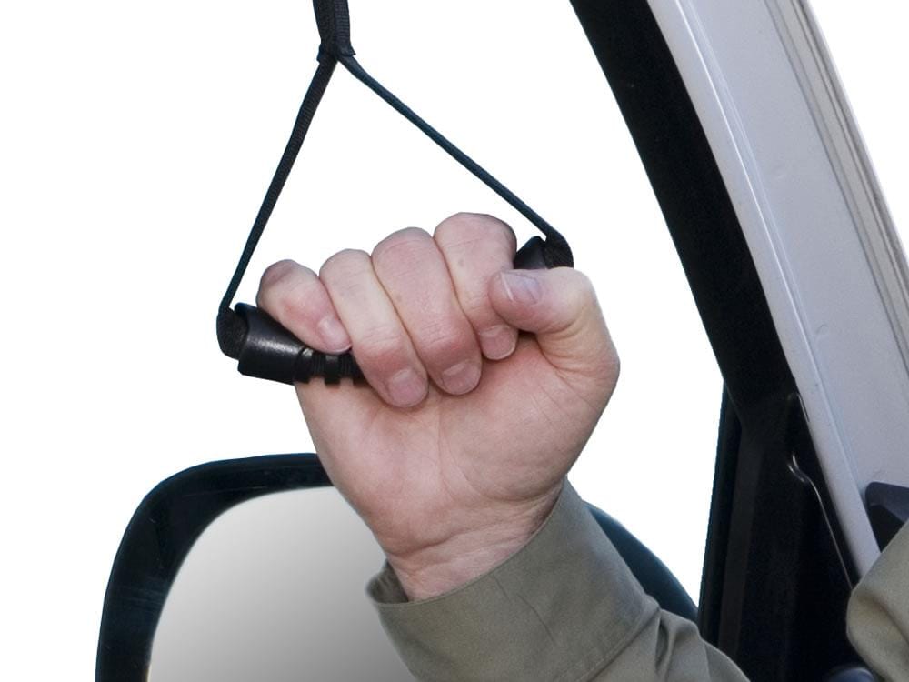 Hand holding the Car Caddie handle inside a car