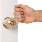 Fist turning a door knob fitted with Great Grips