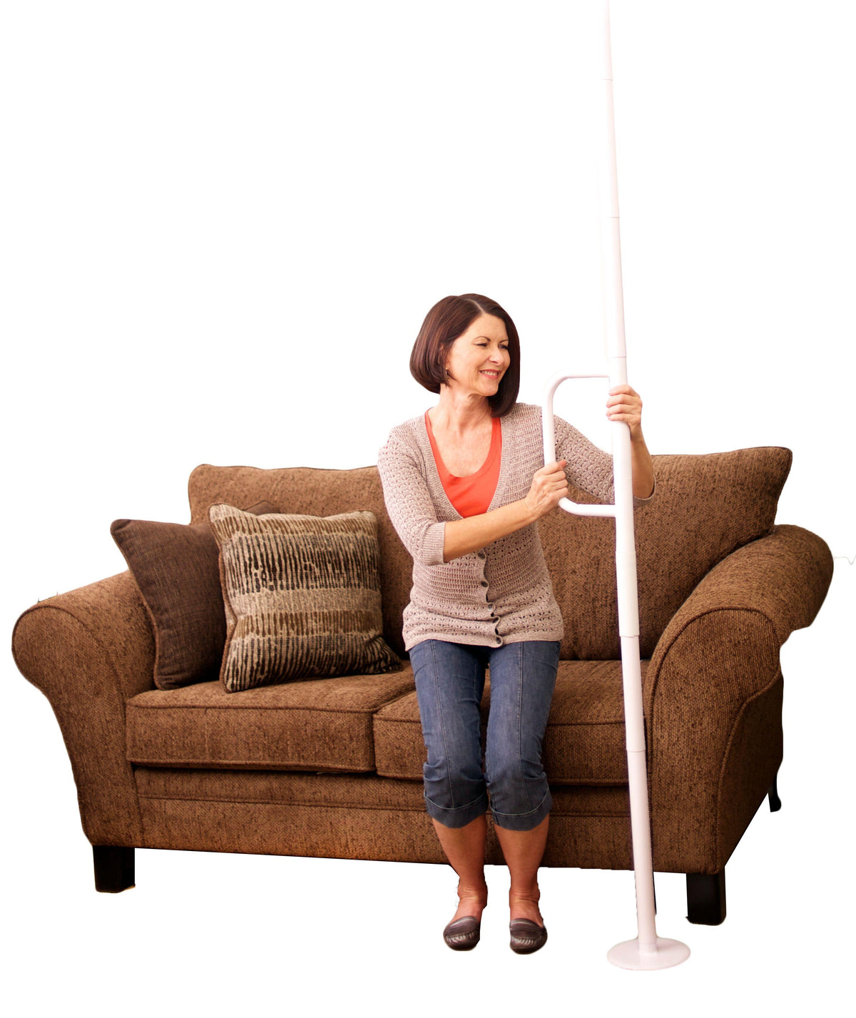 Woman using the Wonder Pole Lite to stand from a couch