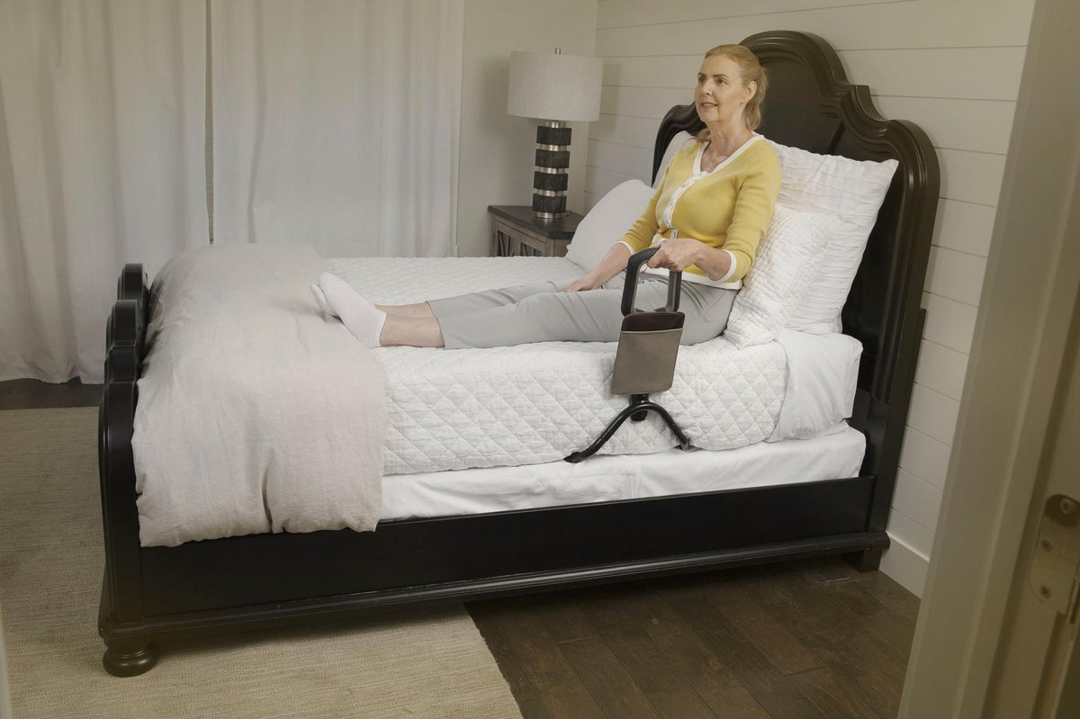 Man in bed with the Confidence Bed Handle