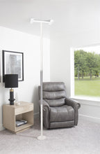 Wonder Pole Slim beside an armchair