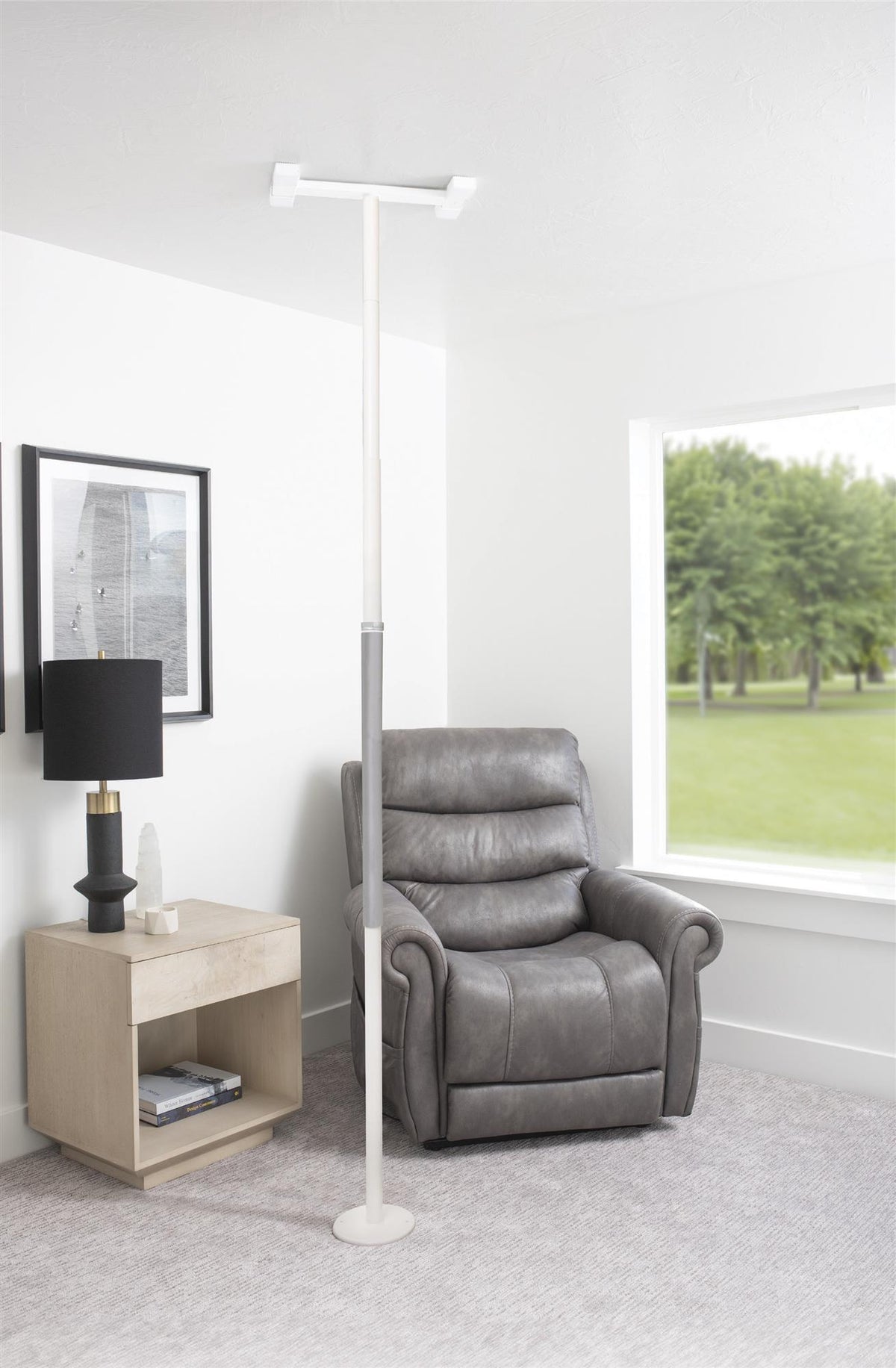 Wonder Pole Slim beside an armchair