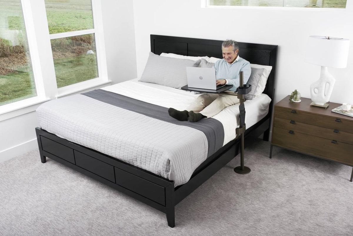 Freedom Overbed Table positioned over a bed