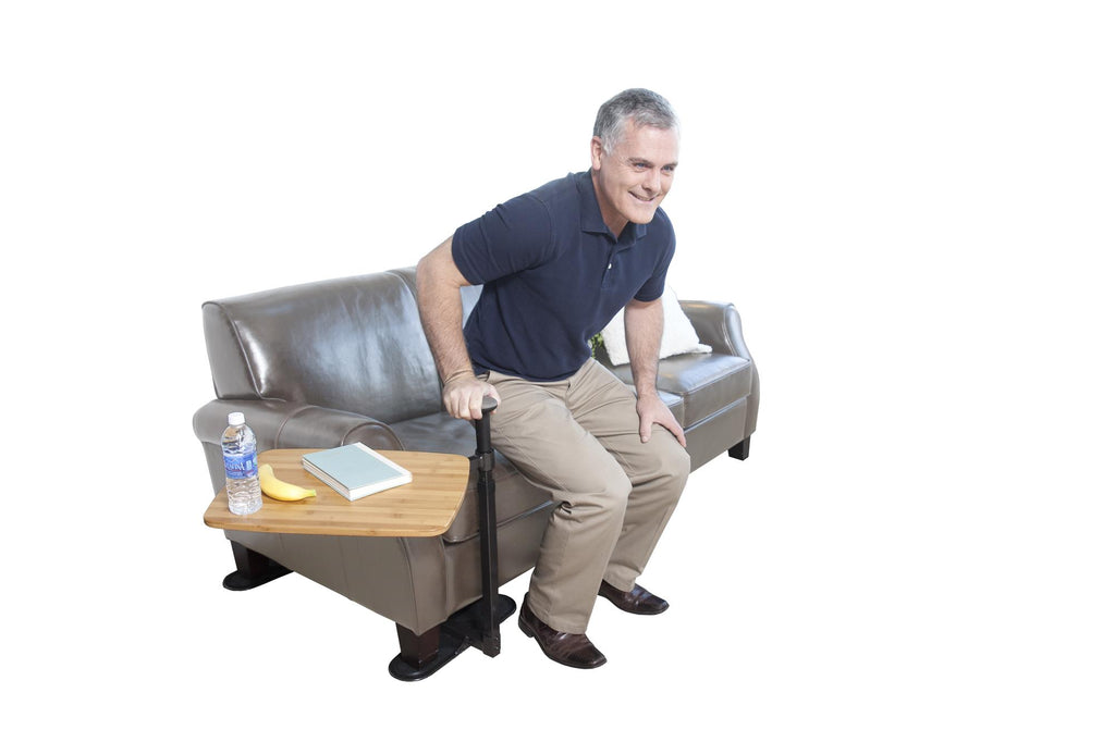 Man seated in a chair using the Omni Tray