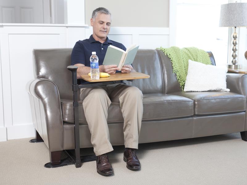 Man using a laptop on the Omni Tray