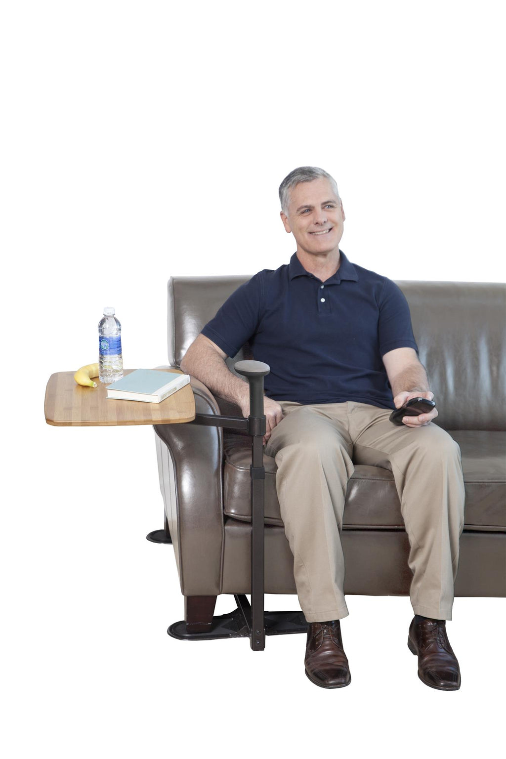 Man in an armchair with the Omni Tray
