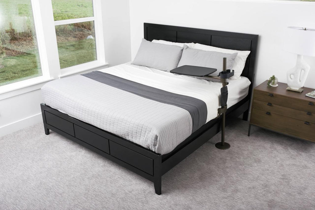 Freedom Overbed Table beside a bed