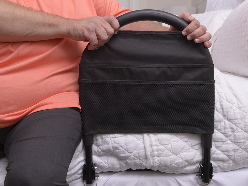 Hand adjusting the Bed Rail Advantage Traveler pouch