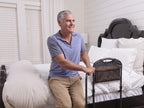 Man getting out of bed with the Mobility Bed Rail
