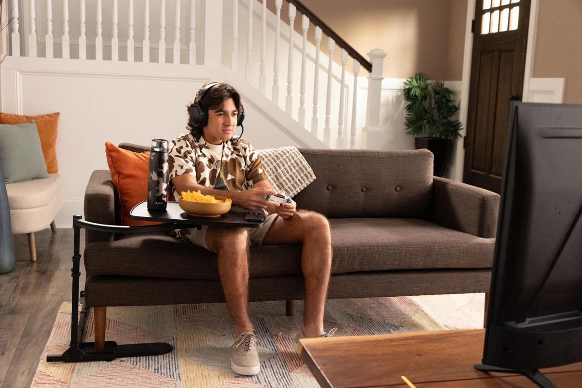 Couple relaxing with the Wonder Tray by the sofa