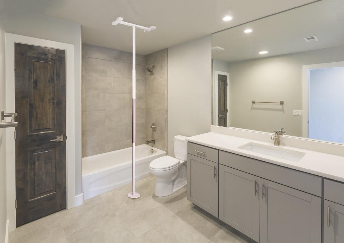 Wonder Pole Slim beside a shower